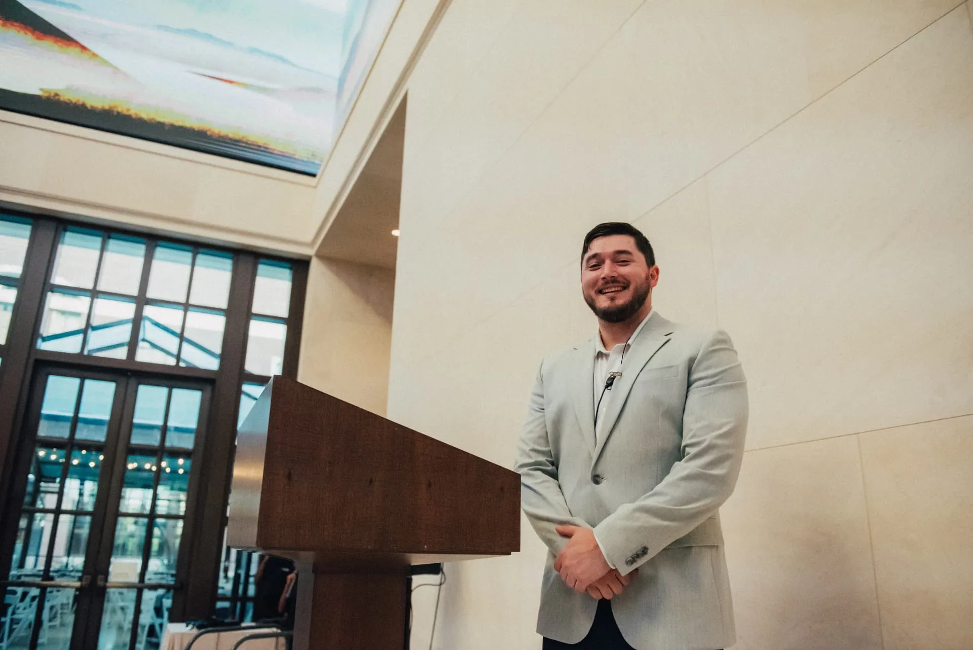 Tyler Dozier waiting beside a podium before going on stage