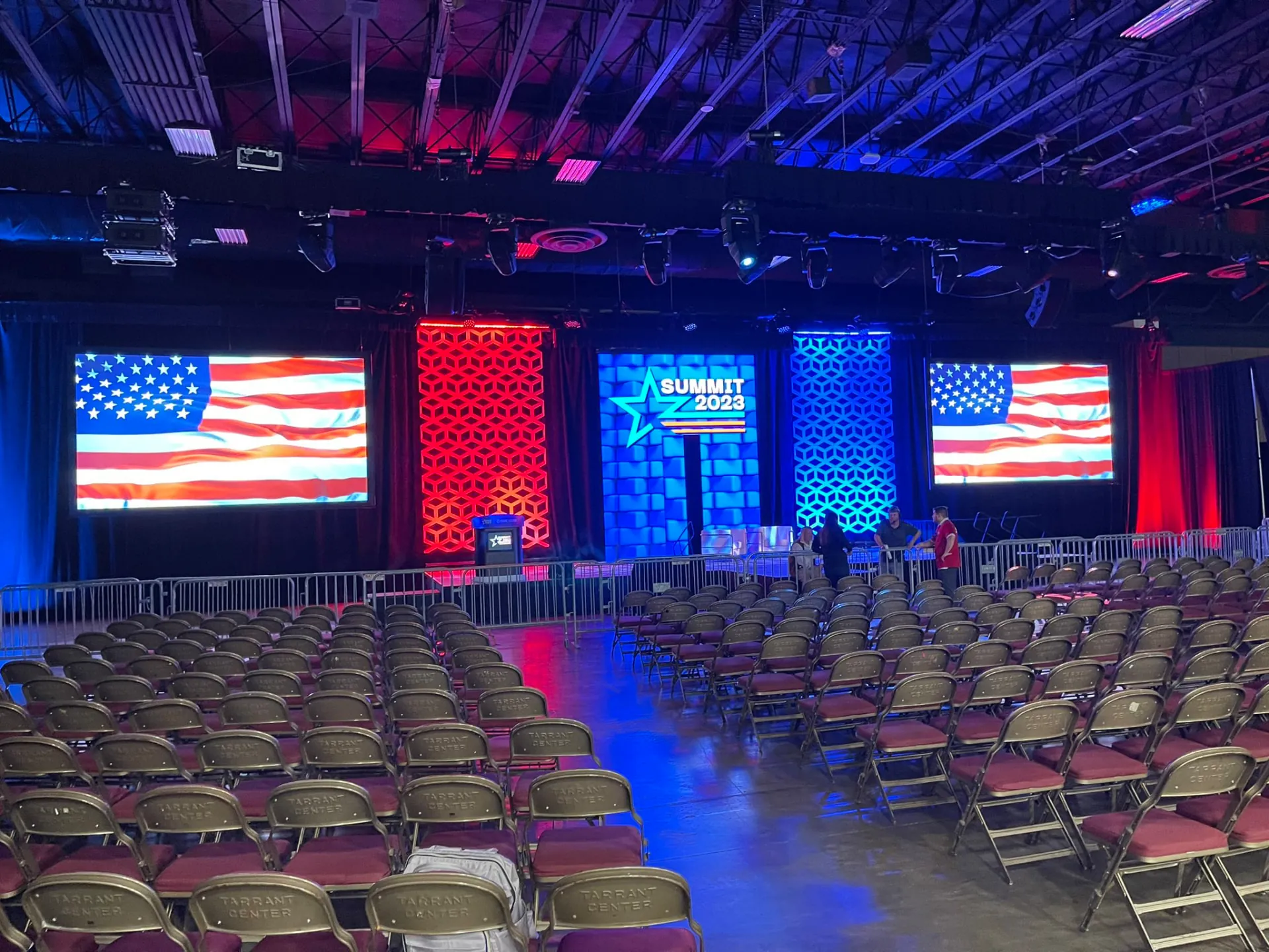 A ballroom staged with LED screens before doors open